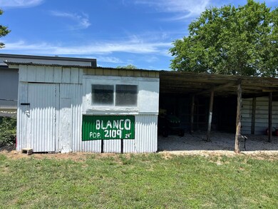 View of pole building featuring a carport and a l