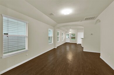 The photo shows a spacious, well-lit room with mul