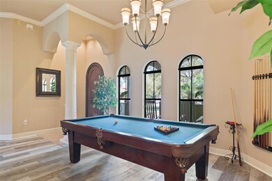 Entrance to formal dining/living. Current billiards room. Crown molding.