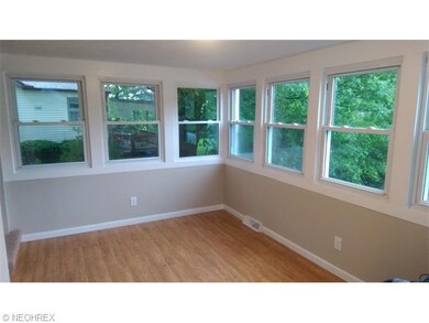 Sun room or Eating area off Kitchen features 10 wi