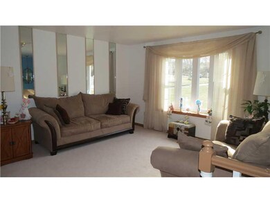 Living Room. The living room is bright and sunny, 