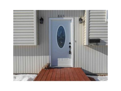 Front Exterior. New front and sliding deck doors.