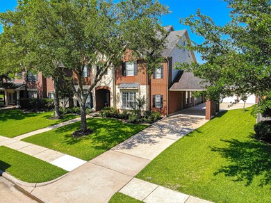 3 car garage with long drive way and porte-cochere.