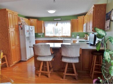 Open and Inviting Kitchen with Counter Sitting Are