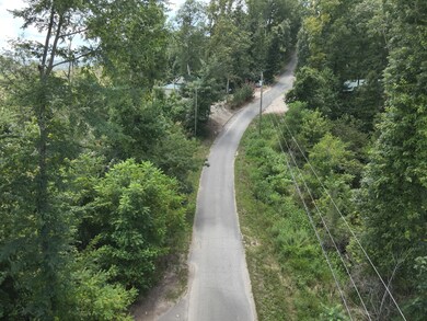 Property on the left side of the road.