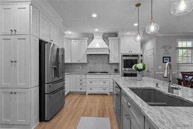 Kitchen featuring appliances with stainless steel