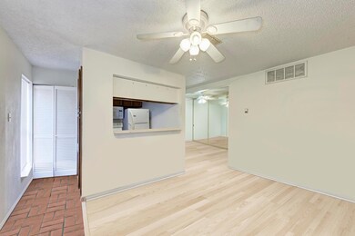 Spare room with ceiling fan and a textured ceiling