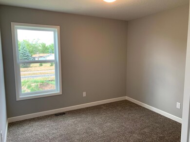 Each of the home secondary bedrooms are perfectly sized and all feature big closets! Model photo.