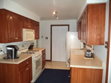 Kitchen with cherry cabinets and pantry