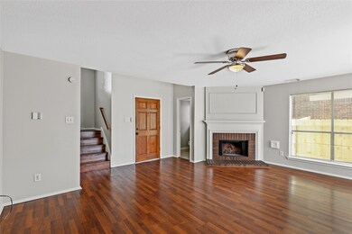 Notice the fireplace and flooring.