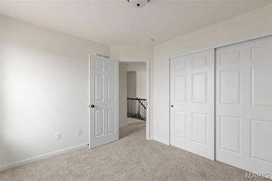 Unfurnished bedroom featuring carpet floors and a closet