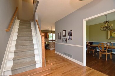 Foyer with wood floor looking into the house