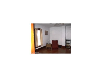 Gleaming hardwood floors in living room.