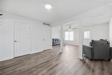 Dining room/living room open concept featuring new floors