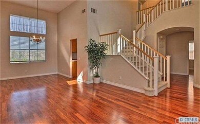 Home boasts rich hardwood floors.