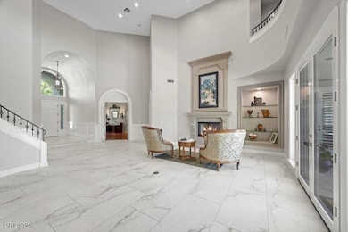 This unique living room with 23 foot ceilings