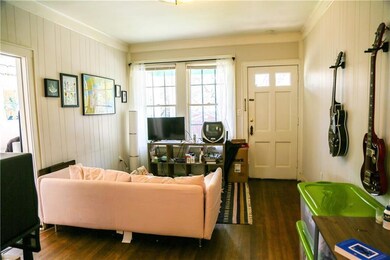 Living room featuring dark wood finished floors, 