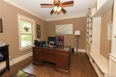 The office features an entire wall of built-in she