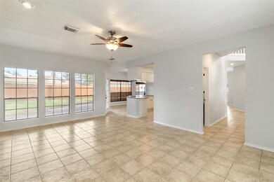 The main living area has six large windows that fl