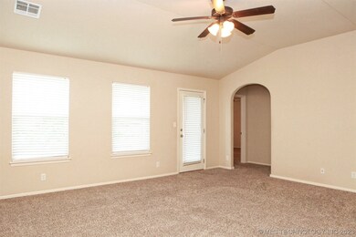 Family room has a lighted ceiling fan, nice window