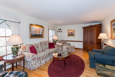 Living room to the left of the formal entrance...