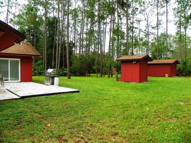 Back yard with patio pump house and shed