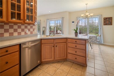 kitchen with maple cabinets and quartz countertops