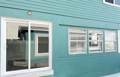 bonus room with slider and lots of windows