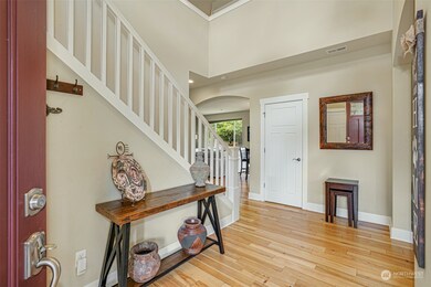 Gorgeous entry with hardwood floors throughout