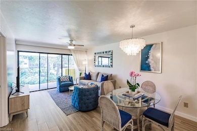 Dining space with hardwood / wood-style flooring a