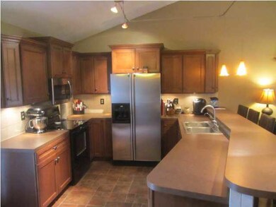 Newer cabinets, lighting, tile backsplash, applian