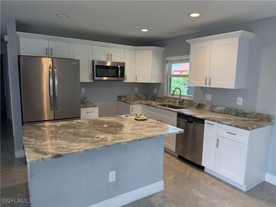 Kitchen featuring stainless steel appliances, ston