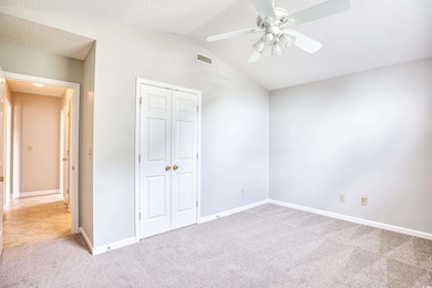 Unfurnished bedroom featuring a closet, carpet flo