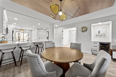 Dining space featuring wood ceiling, wine cooler,