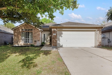 Ranch-style house with driveway, brick siding, an