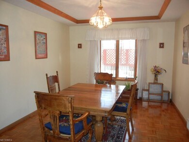 Formal dining room with parquet floor and crown mo