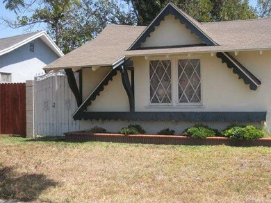 Side of Garage with Ornamental Gate to Yard