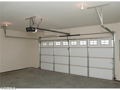 Parking Lot/Garage - The spacious garage can accom