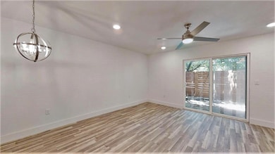 Spare room with recessed lighting, baseboards, li