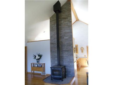 Living Room. Soap stone woodburning fireplace. Use