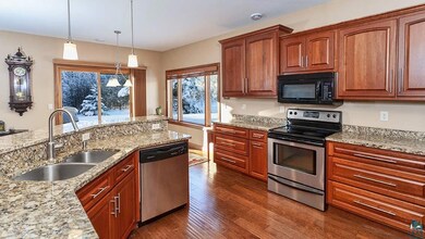 breakfast bar, granite counter tops and cherry cab
