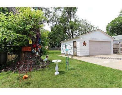 Exterior Back. 2 1/2 car garage with extra parking
