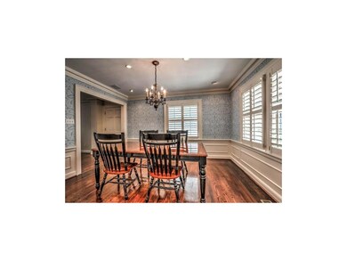 Dining Room features English wallpaper and plantat