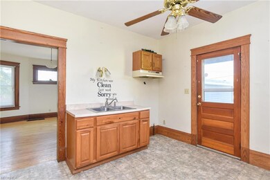 Updated kitchen with door leading out to the back 