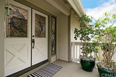 Enter home through stained glass double doors 