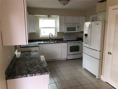 Pantry Closet beside refrigerator.