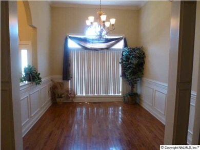 FORMAL DINING W/HARDWOOD FLOORS/CROWN MOLDING