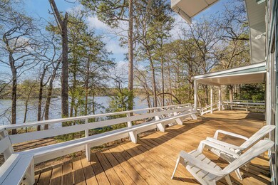 Wooden deck featuring a water view