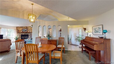 View of front door entrance and into living/dining