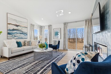 (Photo of decorated model, actual home's finishes will vary)The great room is cozy and contemporary.